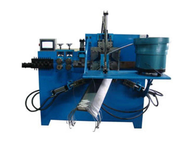 Machine de pliage pour anse de seau